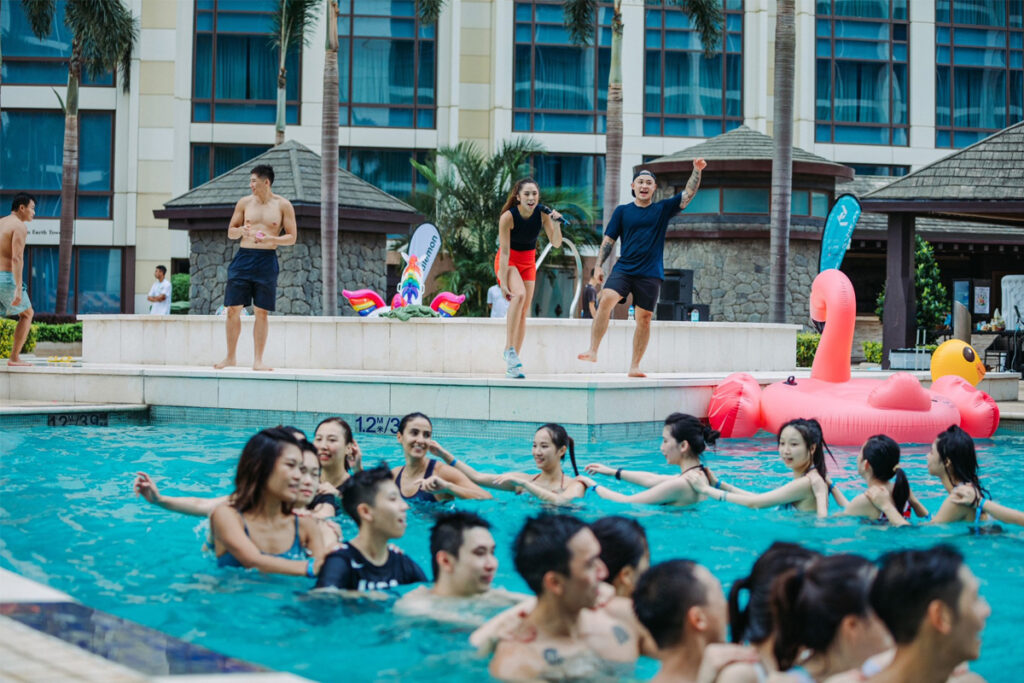 coach debora leading an exercise bootcamp in the pool