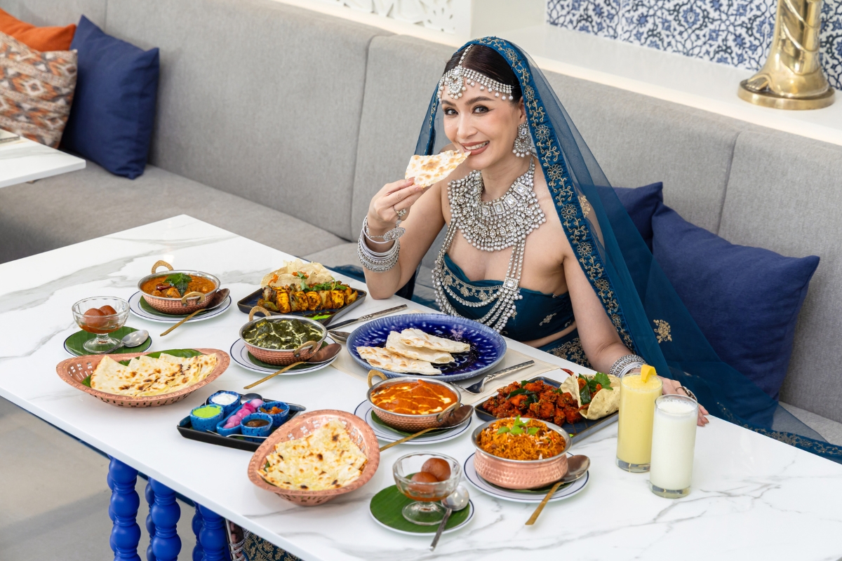woman eating halal food at maharani