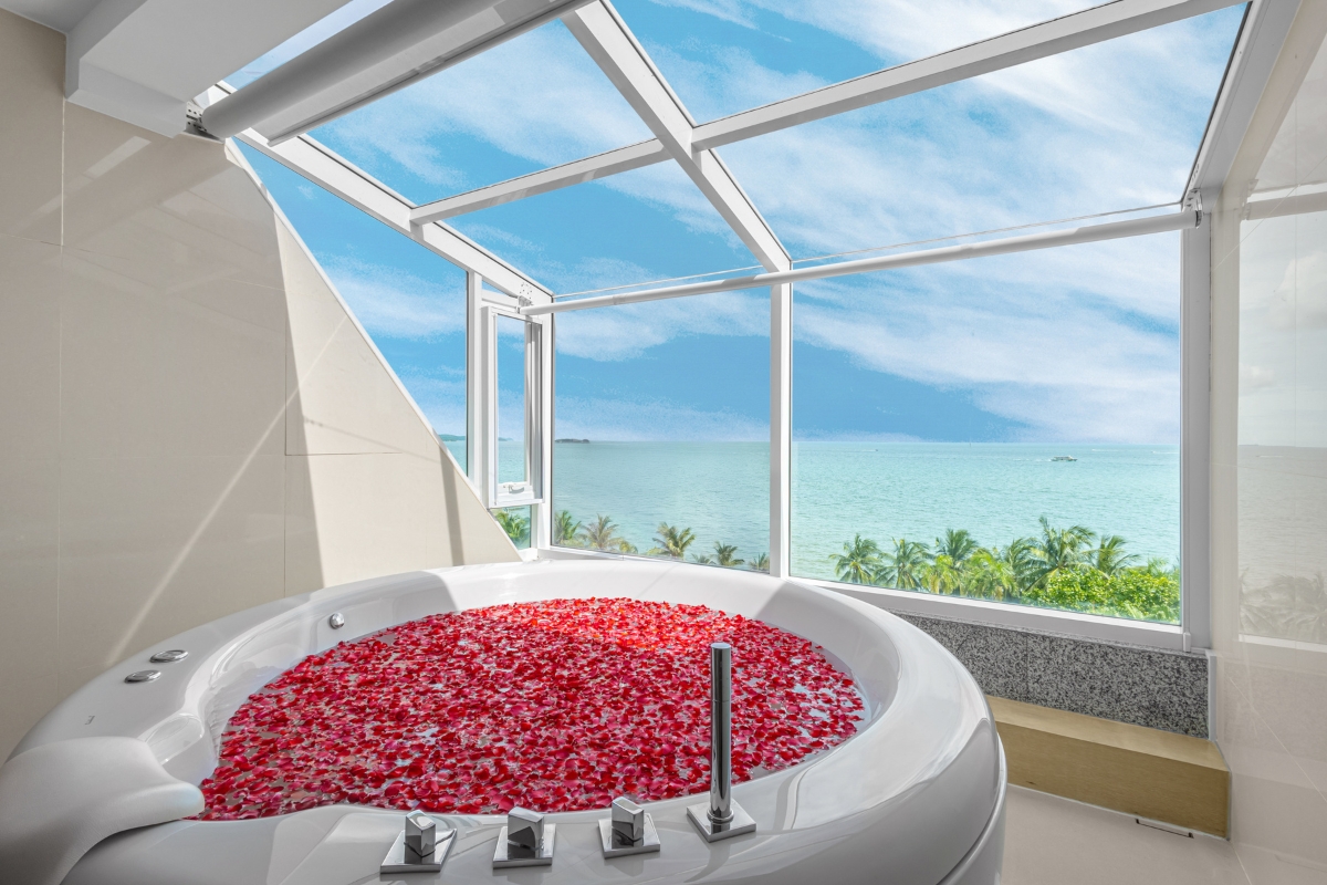 rose petal covered jacuzzi with ocean views at our ultra luxury hotel