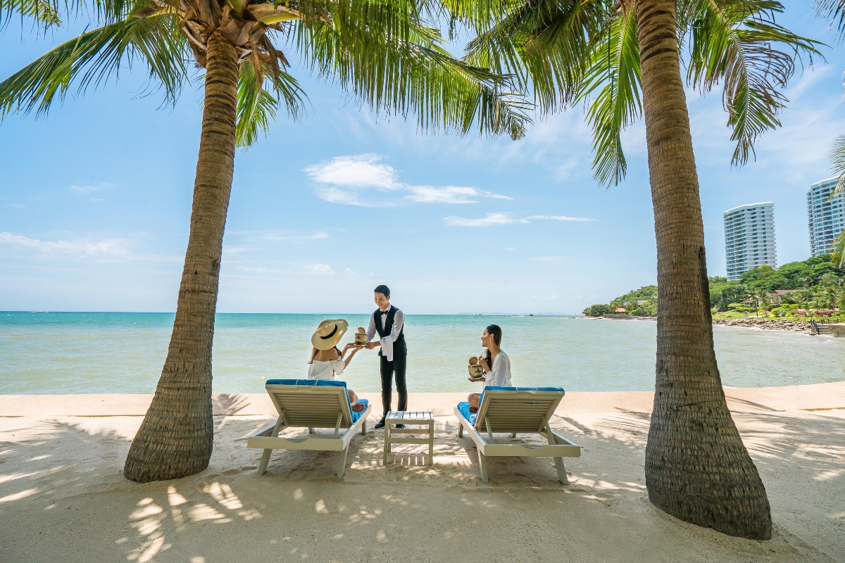 hotel butler serving guests on the beach