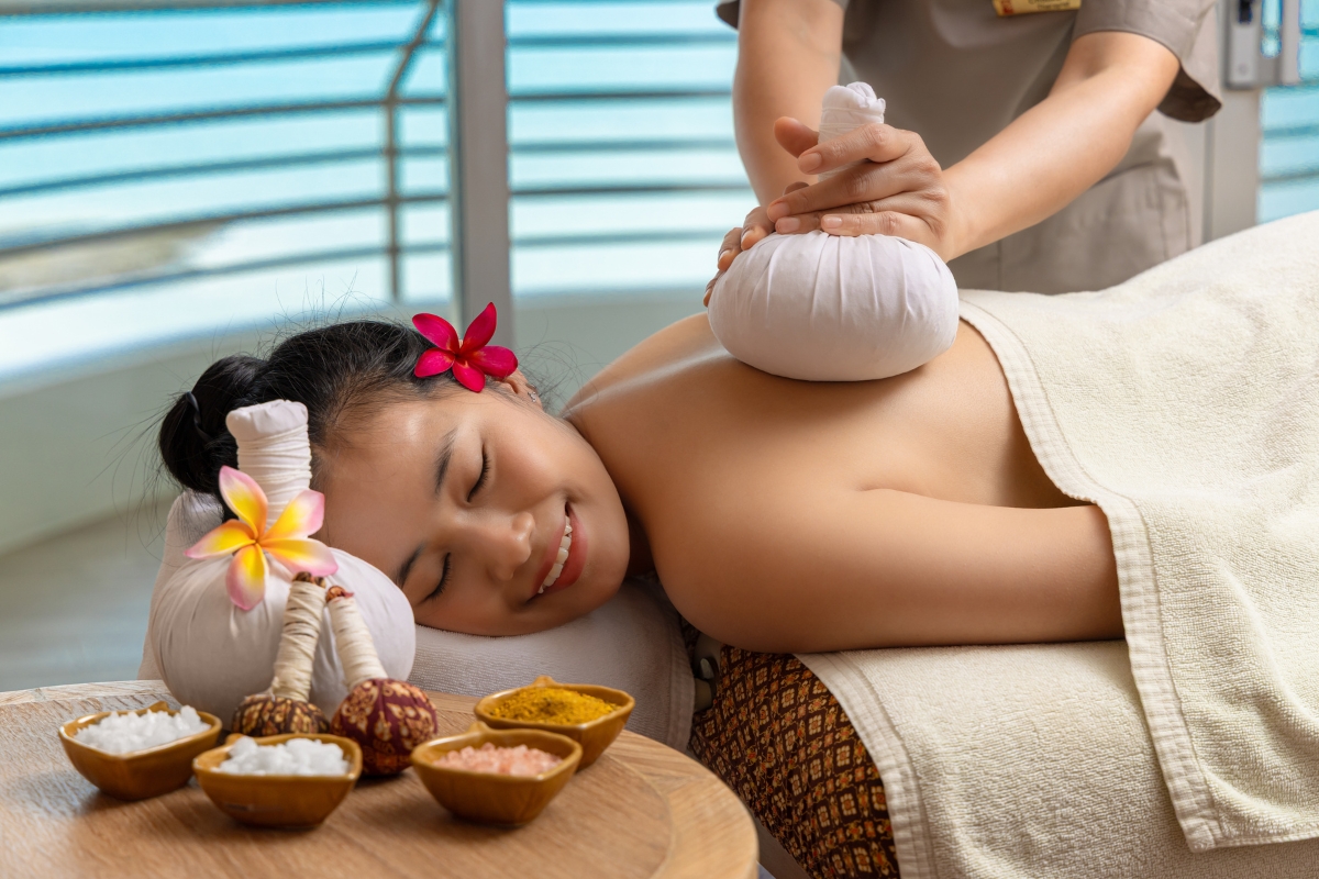 woman happily enjoying a thai massage