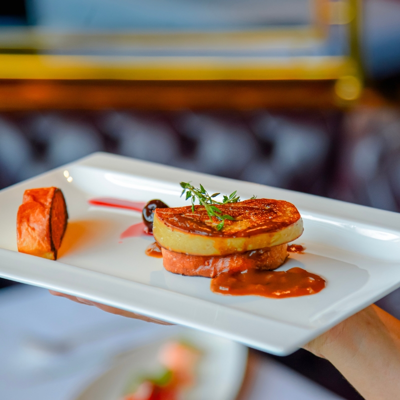 close-up of foie gras dish at royal wing suites & spa
