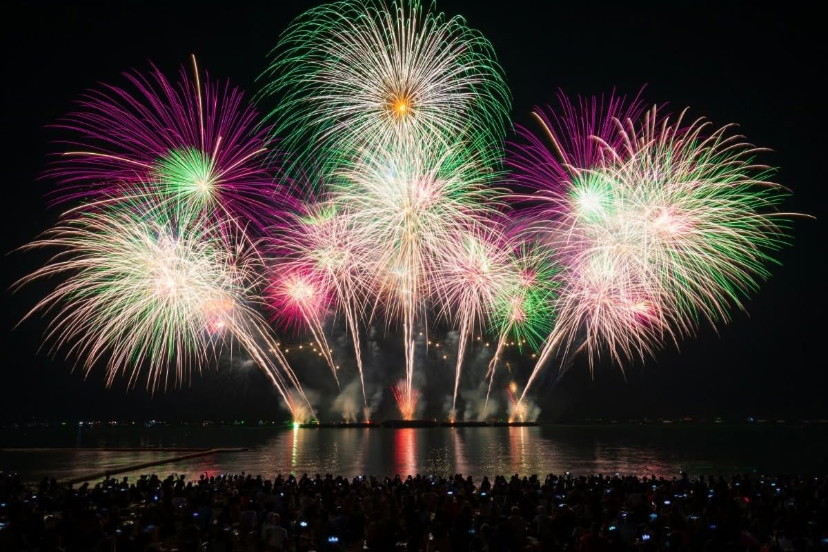 pink and green fireworks over pattaya beach at pattaya fireworks festival 2026