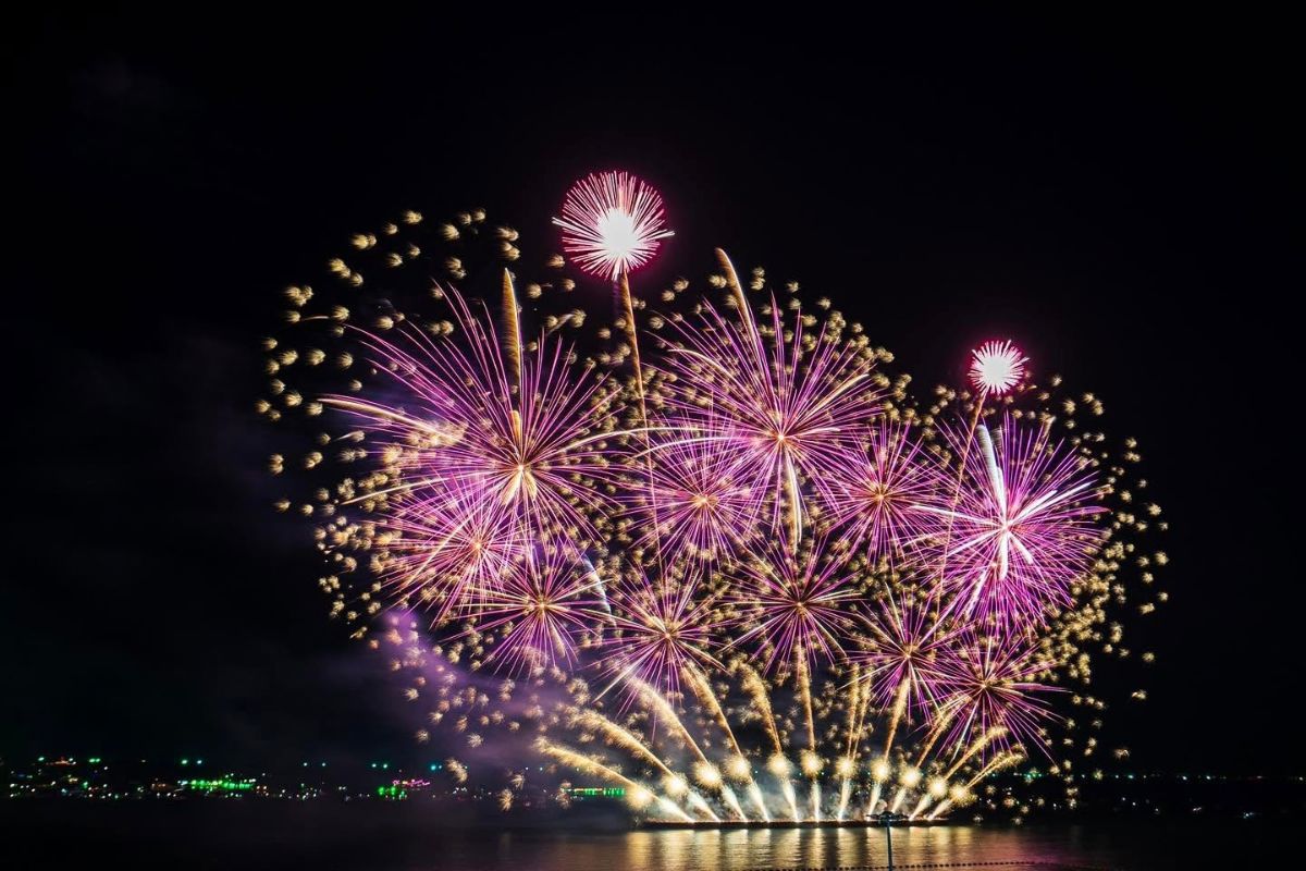 pink and yellow fireworks at pattaya fireworks festival